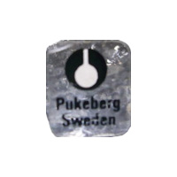 Pukeberg Swedish glass clear plastic label - black text.